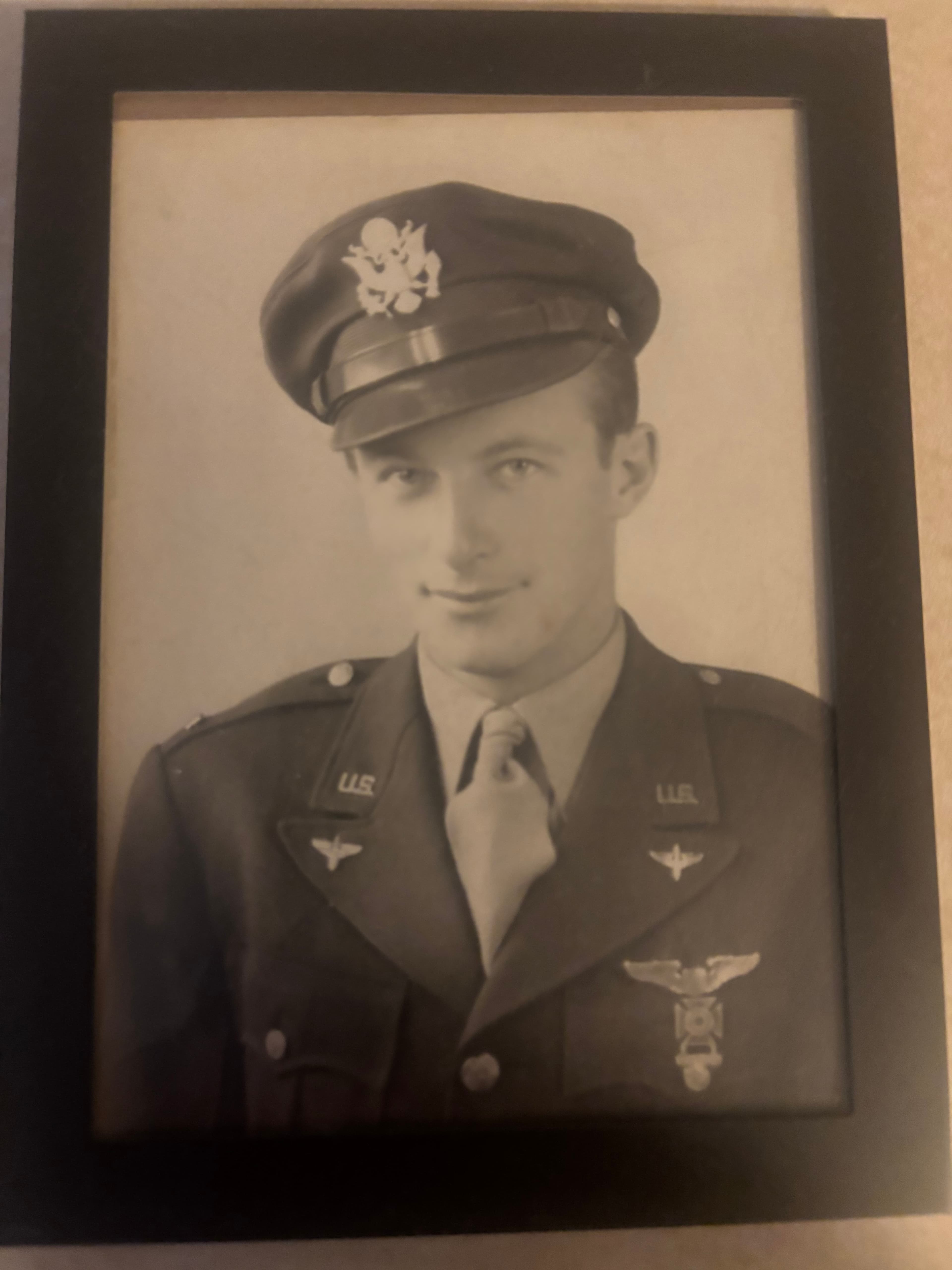 A framed portrait of Chris Cox's grandfather in uniform