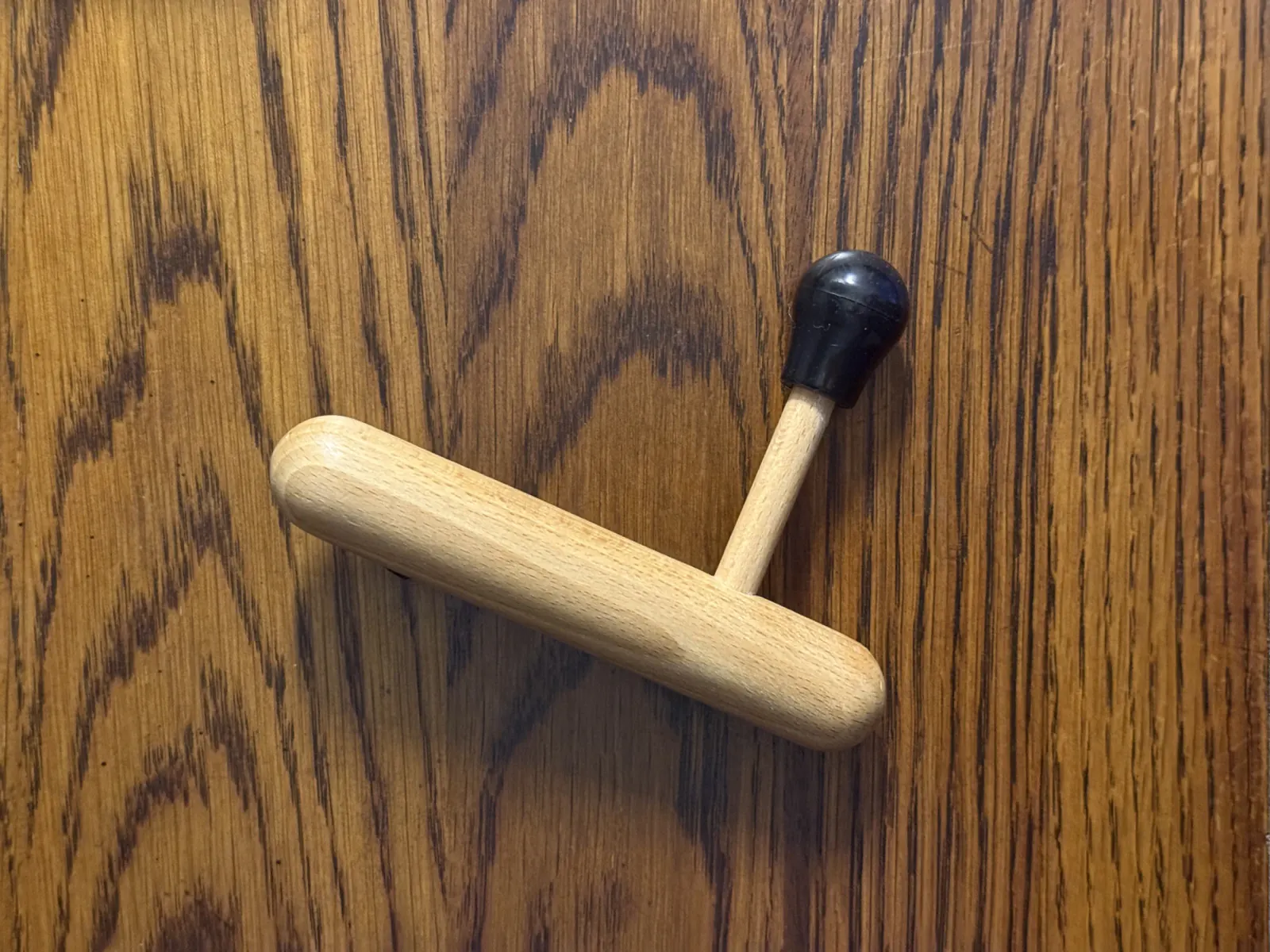 Two wooden pressure tools used for focused bodywork