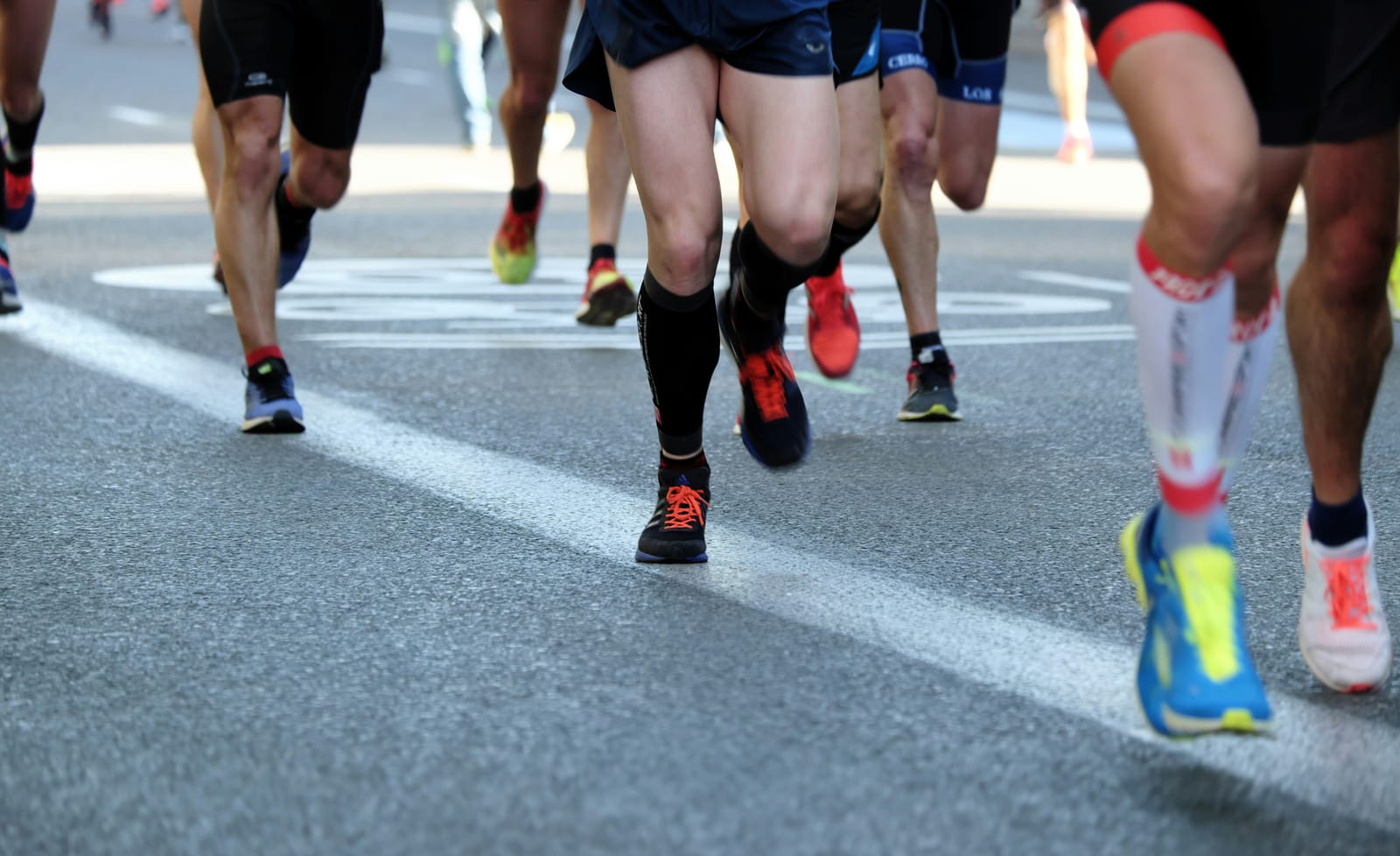 Runners moving together on a paved outdoor route