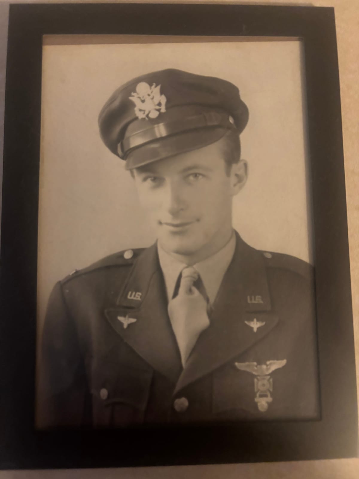 A framed portrait of Chris Cox's grandfather in uniform